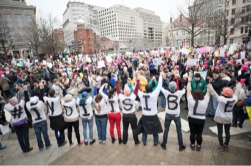 Indivisible group in public taking action